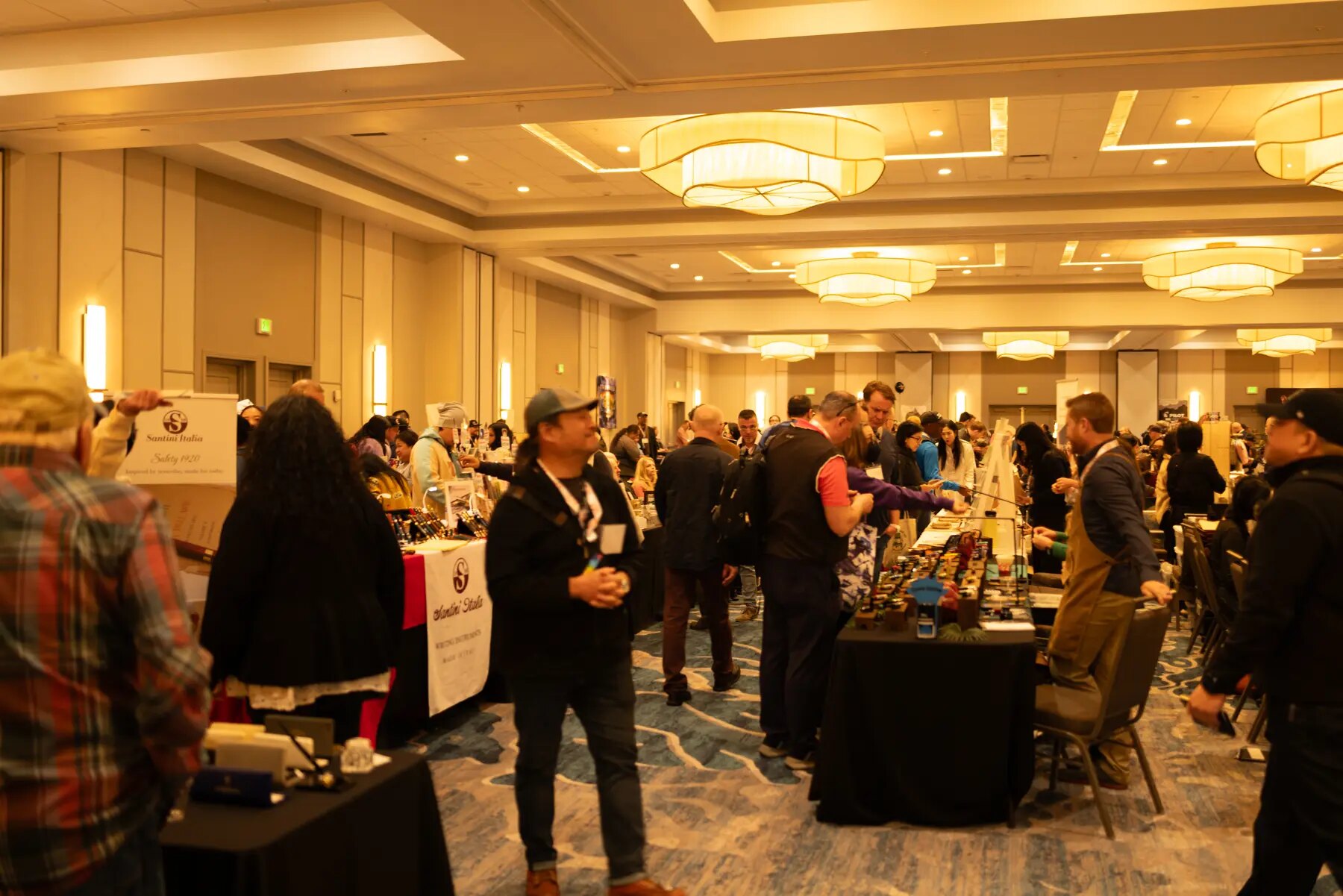 Visitors meeting vendors and discovering stationery at the California Pen Show